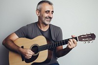 Happy mature man guitar musician portrait. AI generated Image by rawpixel.