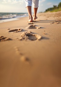 Human footsprint on sand beach in summer,. 