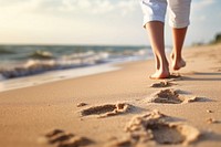 Human footsprint on sand beach in summer,. 