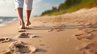 Human footsprint on sand beach in summer,. 