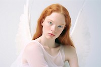 Mixed race ginger woman angel photography portrait. 