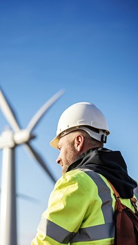 photo of wind turbine worker checking installation. AI generated Image by rawpixel.