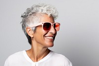 Happy mature woman sunglasses laughing portrait. 