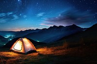 Photo of a tent, in a grass land, moutain in the background, at night, sky full of stars. 