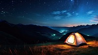 Photo of a tent, in a grass land, moutain in the background, at night, sky full of stars