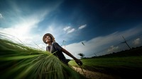 photo of a woman working sustainable farming. 