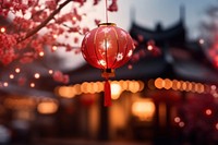 photo of chinese new year lantern, blurred new year's firework in background. 