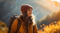 Photo of happy smiling woman hiking in mountains. 