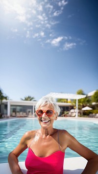 photo of ทature woman wearing swim goggles at swimming pool. 