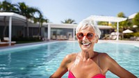 photo of ทature woman wearing swim goggles at swimming pool. 