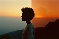 African american woman contemplation backlighting tranquility. 