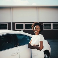 Woman standing by her car. 