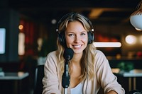 Adult sitting looking recording video. 