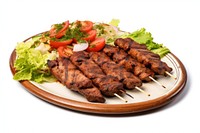 Kebab plate grilling meat. 