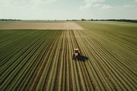 Red Tractor cultivating field farm outdoors tractor. AI generated Image by rawpixel.