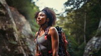 Photo of a african american female hikier go rock climbing. 