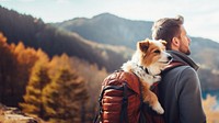 Photo of man travelling with his dog in a backpack. 