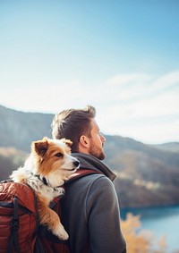 Photo of man travelling with his dog in a backpack. 