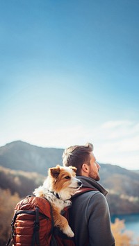 Photo of man travelling with his dog in a backpack. 