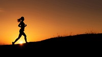 photo of silhouette woman run on the hill with sunset. 