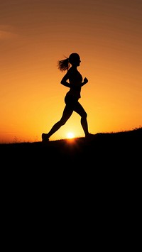 photo of silhouette woman run on the hill with sunset. 