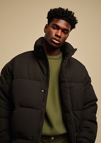 Black man wearing a black puffer jacket portrait adult photo. 