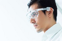 Engineer examining AI technology glasses portrait adult. 