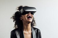 Woman wearing VR glasses technology hairstyle happiness. 