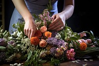 Woman preparing flower bouquet plant adult hand. 