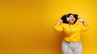 photo of a happy chubby woman wearing earphones.  