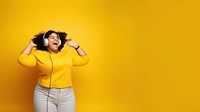 photo of a happy chubby woman wearing earphones.  