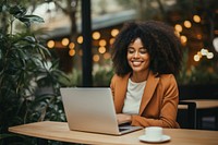 Joyful african woman laptop computer typing. 