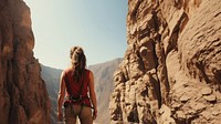 Photography of climber woman at artificial cliff.  