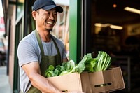 Grocery store vegetable carrying smiling. 