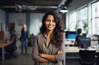 Happy indian woman smiling standing portrait office. 