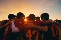 Football players outdoors huddle adult. AI generated Image by rawpixel.