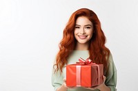 Red hair girl smiling hugging a big gift box birthday celebration anniversary. 