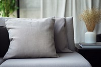 Close-up grey sofa with pillow photo. 