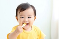 Baby eating biting food innocence. 