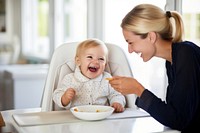 Baby eating adult togetherness happiness. AI generated Image by rawpixel.