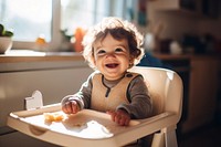 Baby wearing knitted sweater portrait sitting eating. 