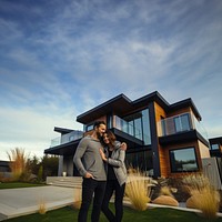 Couple with their new house. 