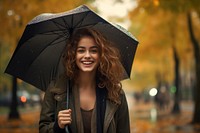 Young woman umbrella portrait smiling. 