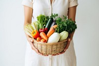 Woman holding beautiful vegetables basket adult woman food. 