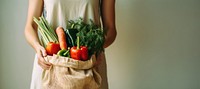 Woman holding vegetable food bag midsection. AI generated Image by rawpixel.