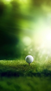 golf ball is sitting on a tee with a golf club in the background. AI generated Image by rawpixel. 