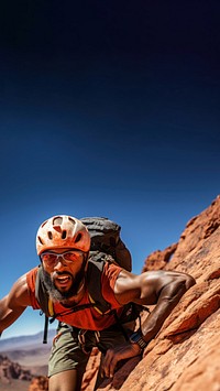 Photo of a african american hikier go rock climbing.  