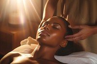 Black Woman receiving a head massage adult woman spa. 