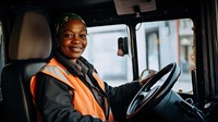 Photo of a diverse women bus driver.  