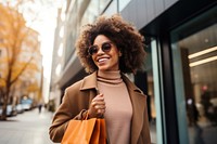 Woman shopping holding adult coat. 